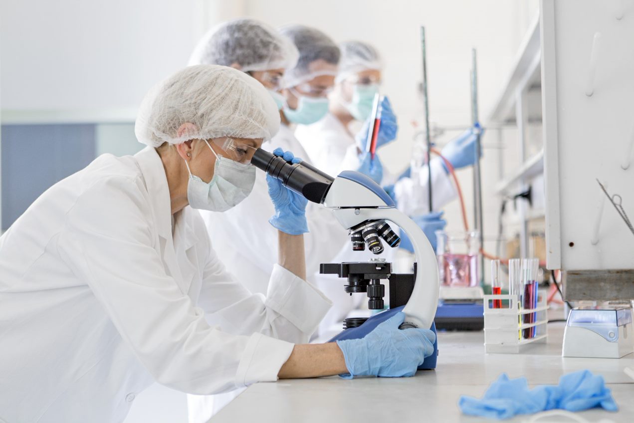 A woman using a microscope