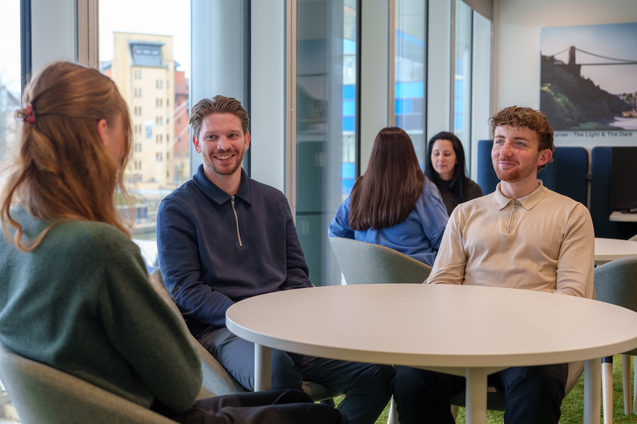 Image of TSP trainees sat around a table.