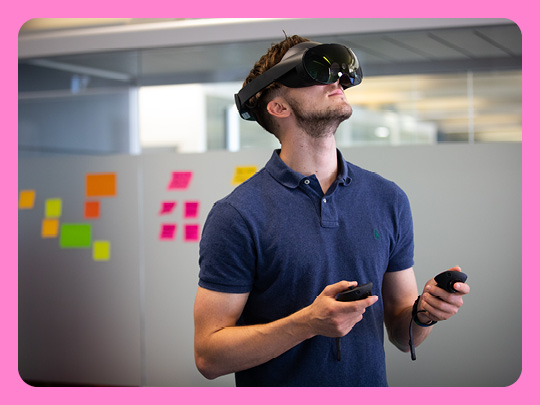 Images shows person using virtual reality headset