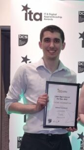 Photo of Alfonso Greenbrook holding a certificate