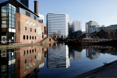 Decorative Image: Photograph of DWP's Birmingham Hub alongside other canal side buildings.