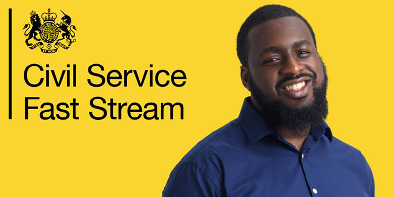 A Civil Service Fast Stream poster, showing a man smiling, in front of a bright yellow background.
