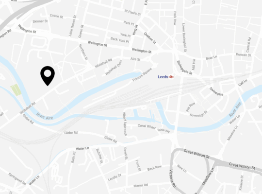 An image of a map of leeds with a location pin at the office address on Wellington Place. The pin is close to Leeds train station and in the city centre
