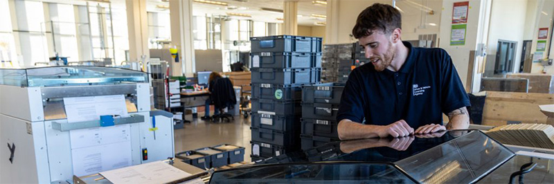 A member of the DVLA Operational and Customer Service Directorate (OCSD) printing documents.