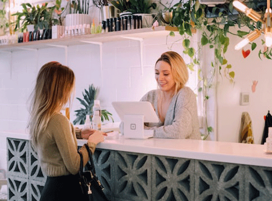 Shop assistant and customer at checkout