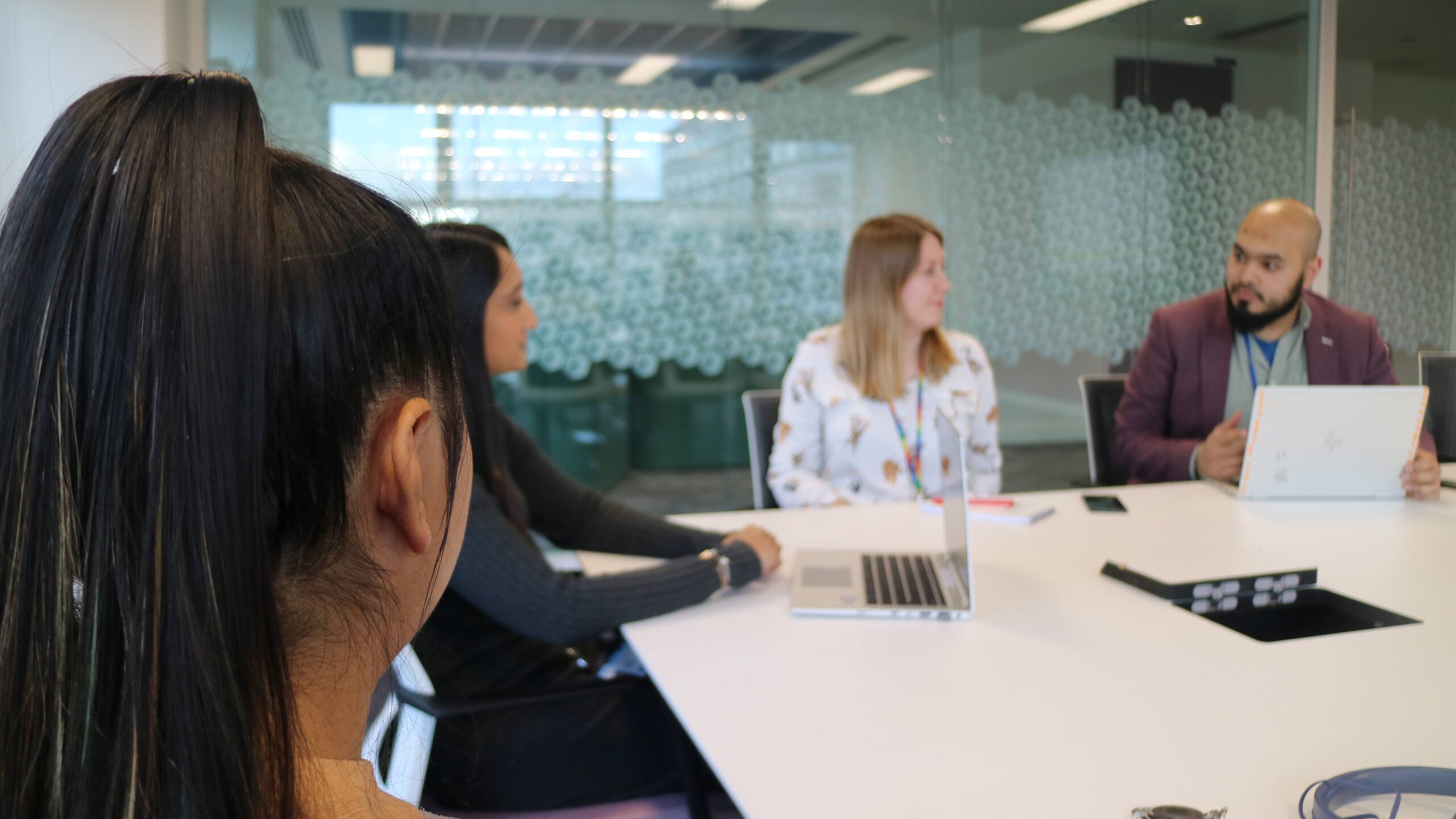 CMA colleagues around a table, in discussion