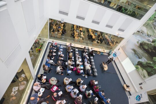 Audience listening to a speaker at a learning and development event.