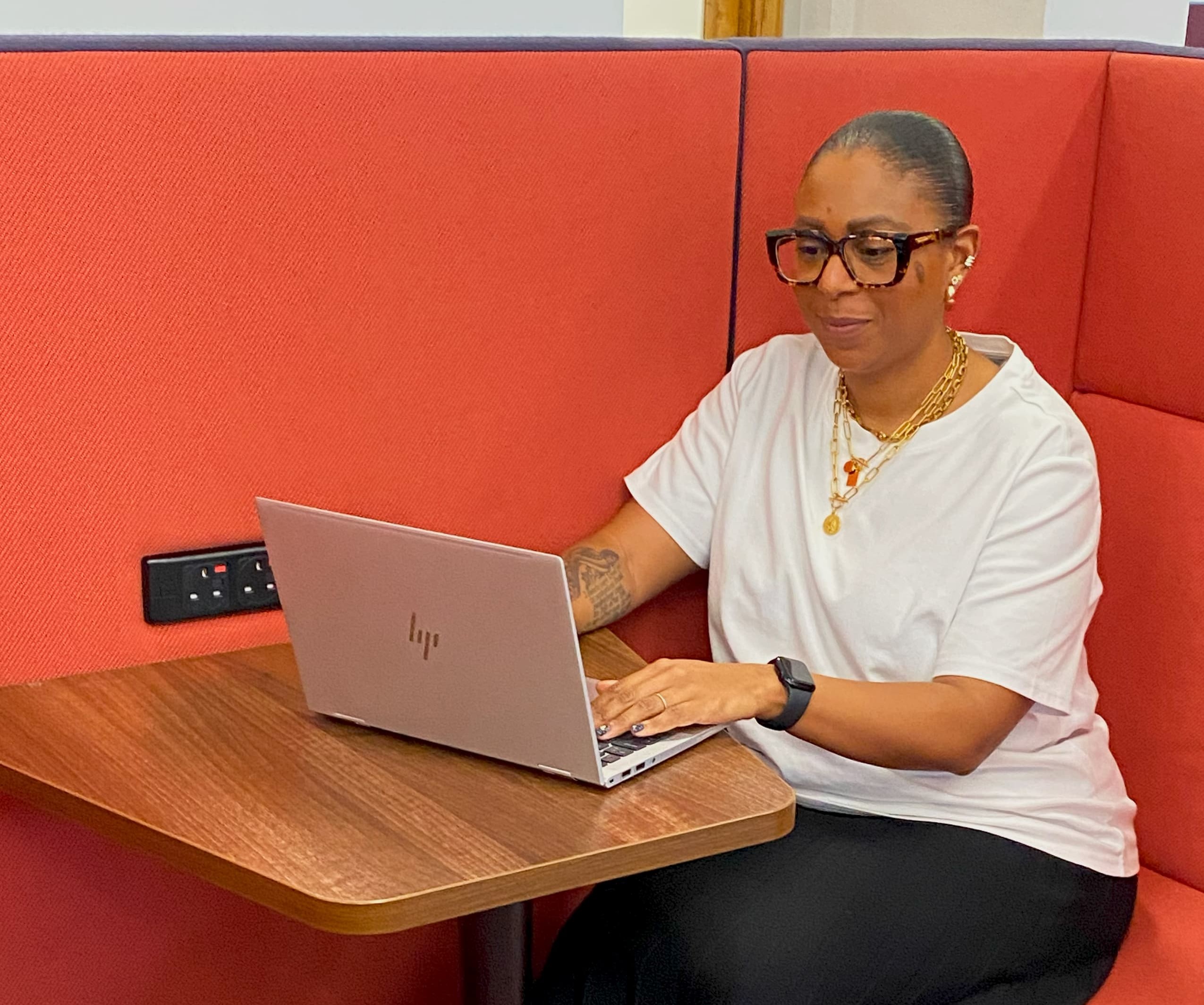 woman sat working at laptop