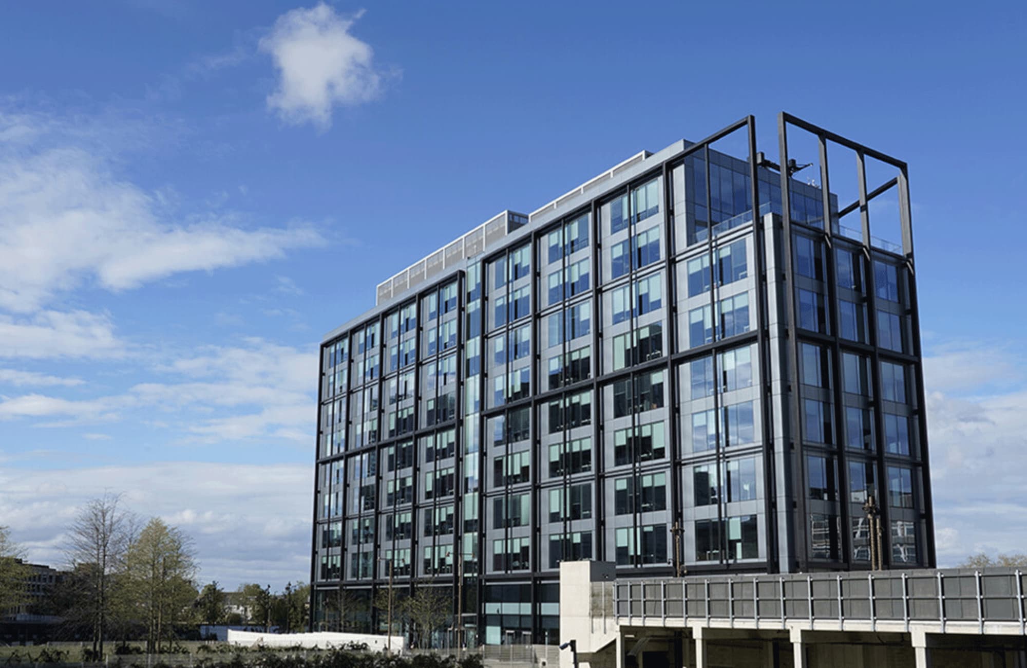 A photo of the HMRC regional centre building. It is a modern glass building.