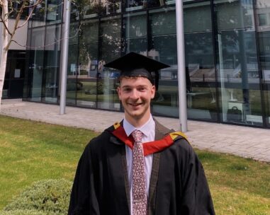 Matthew in university graduation robes
