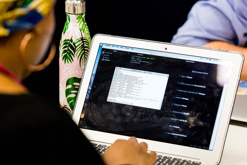 Decorative image: a person working on their laptop