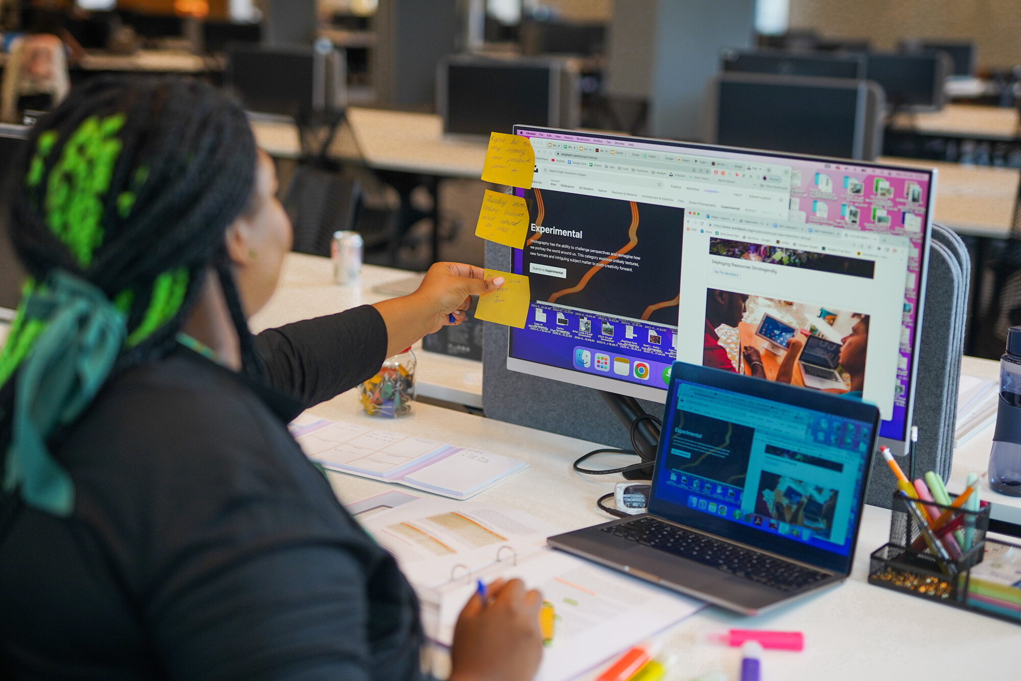 A woman with a less visible disability working on a laptop.