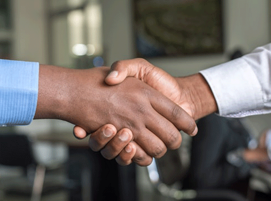 Two people shaking hands