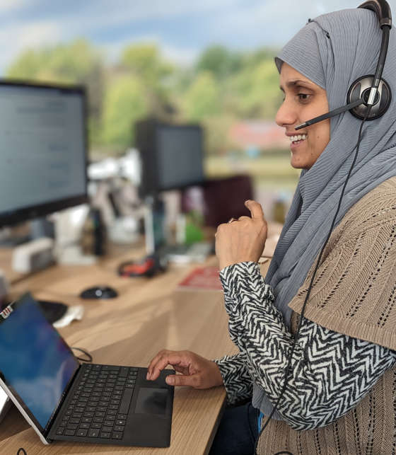 Customer Service Advisor wearing hijab and speaking on a headset