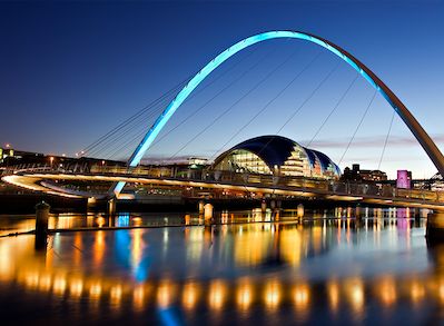 Decorative image: a photo of the Millennium Bridge on The River Tyne, at nighttime