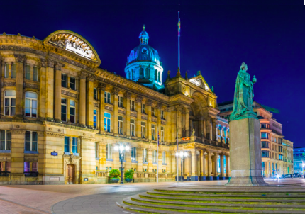 A building in the West Midlands, lit at night.