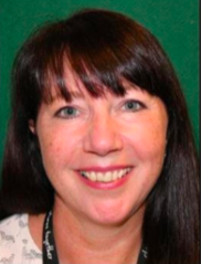 A photo of Donna. She has dark shiny hair with a blunt fringe.