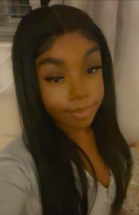 Decorative image: photo of Shechinah-Shantelle Ashmead, she has long dark hair and the photo is taken 'selfie-style'.