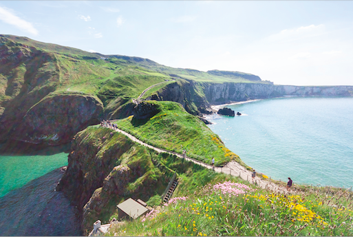 A long meandering coastline, with green hills and blue water