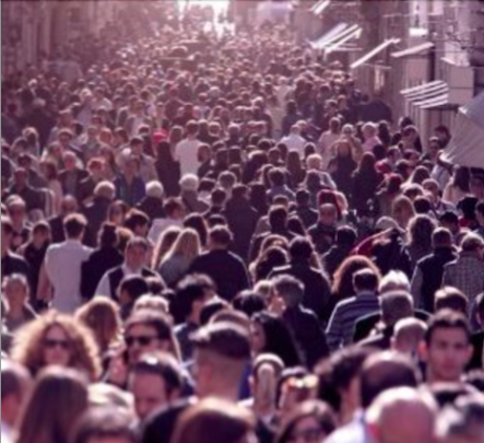 Decorative image: A long street crowded with people