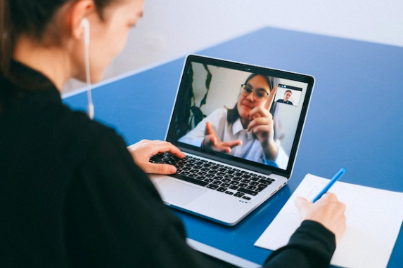 Decorative image: a Photo of Claire Dartington and Marie-Anne Barnes Deputy Directors at the European Finances, HM Treasury. One is sitting at a desk, and the other is on a laptop screen.