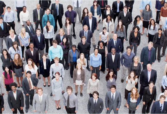 A group of people standing outside, in business wear