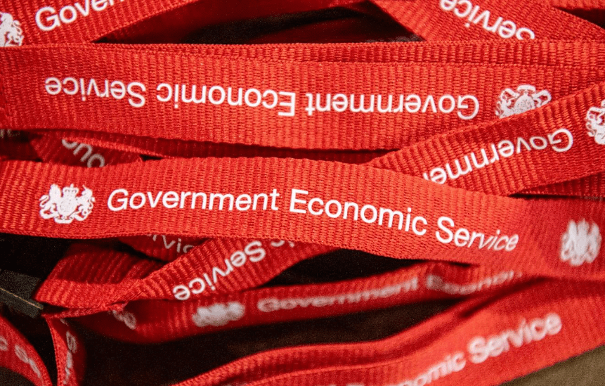 Decorative image: red Government Economic Service lanyards in a pile