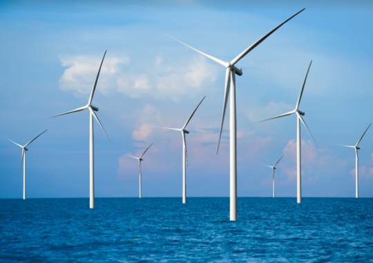 A photo of wind turbines out at sea