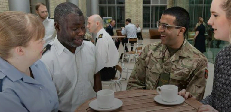Decorative image: A group of military and civilian colleagues having coffee together