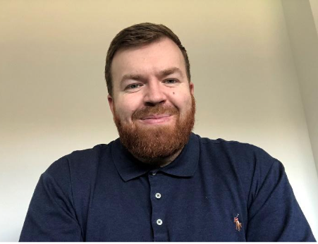 Photo of Dave Race Disability & Housing Support Strategy Division at DWP. He has a beard and is wearing a dark blue polo shirt