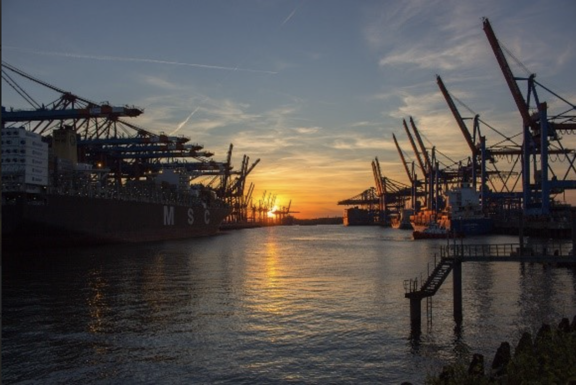 A shipping port at sunrise