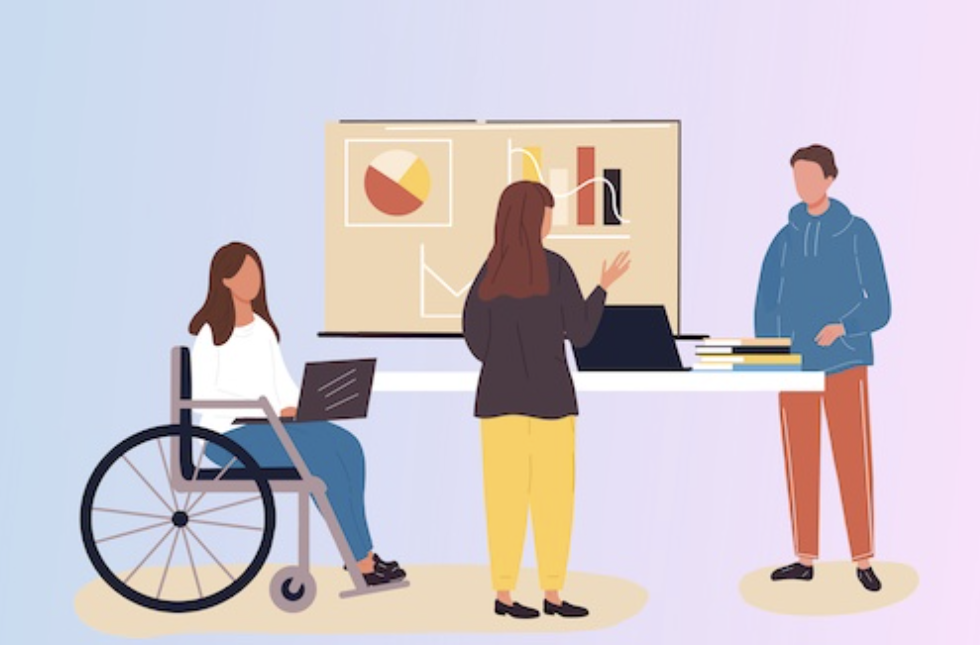 Illustration of 3 people working at a desk together. Two are standing and one is a wheelchair user.