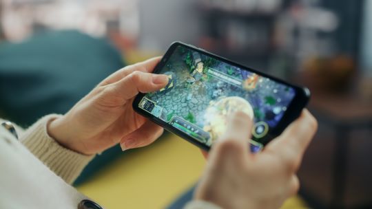 A person playing a game on their phone