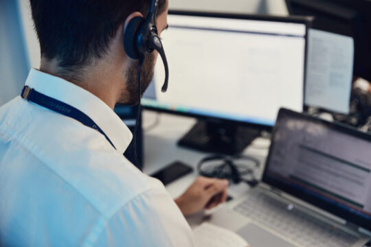 A man working at a computer in an office