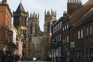 Decorative image: a photo of a street with historic buildings