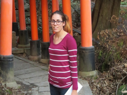 A photo of Charlotte Alford who is a Graduate Engineer. She is wearing a pink striped top and is outside.