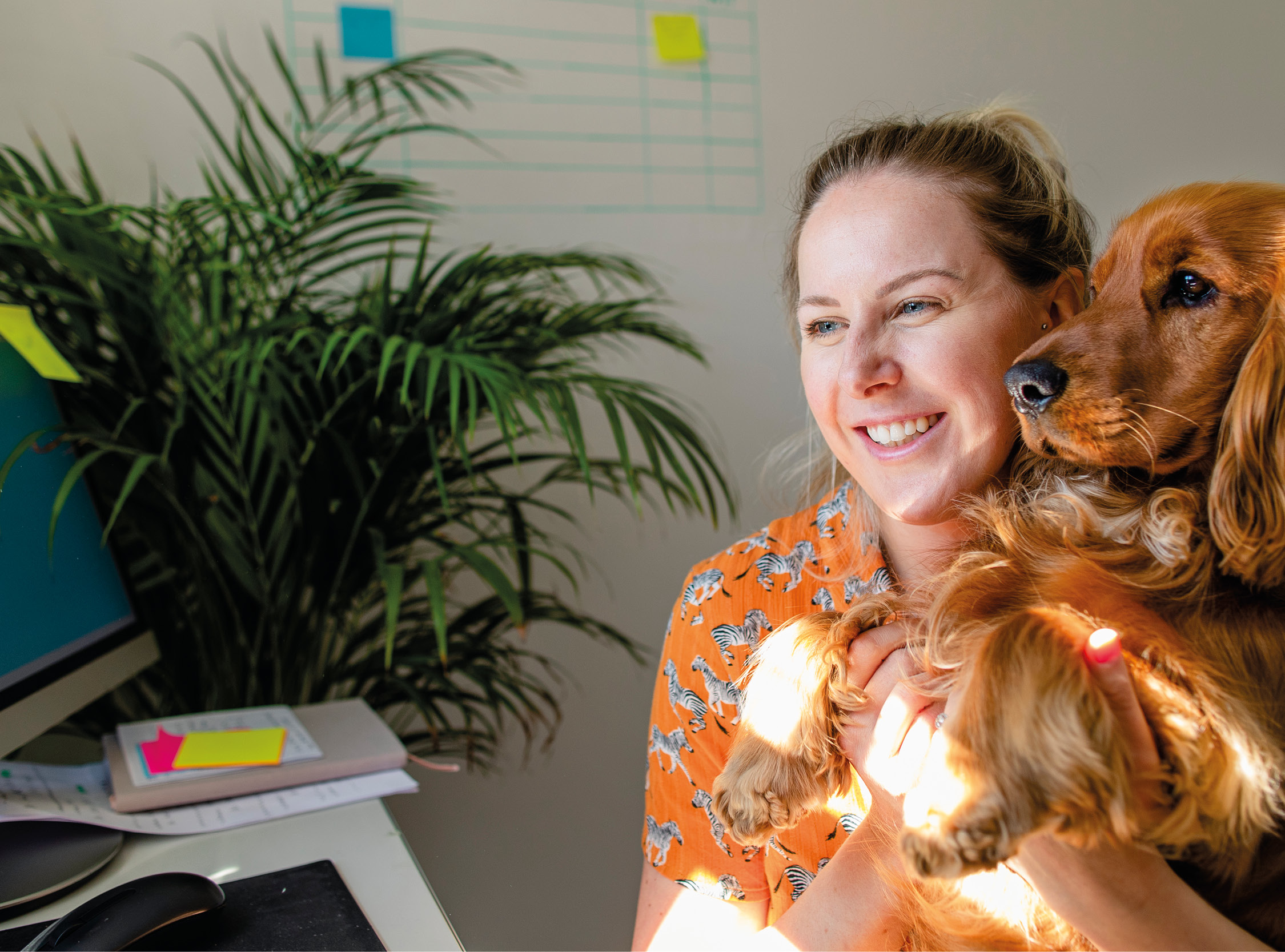 Colleague Working From Home With Pet Dog