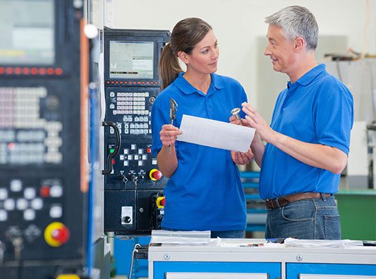 Engineers With Tools In Production Plant