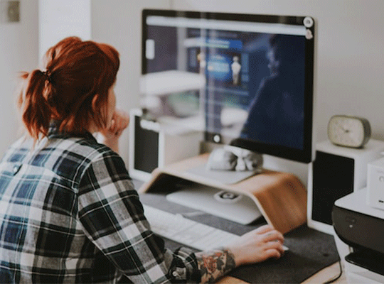 Woman working on computer at home