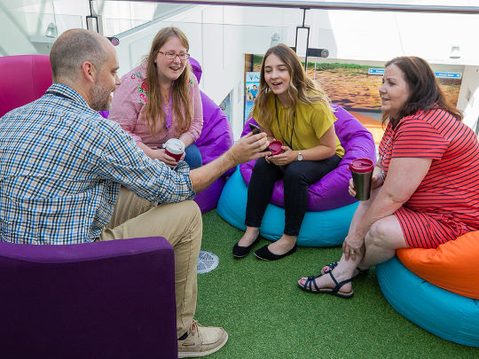 Four Team Members Working On Beanbags At The Dvla