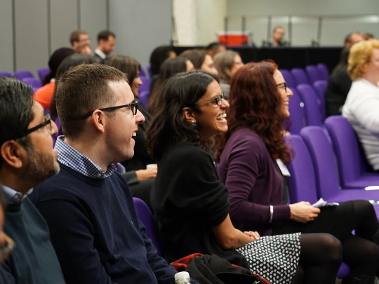 Government Legal Team Members at A Conference, sitting together watching a presentation