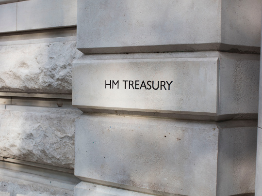 A photo of am HM Treasury sign on a stone building