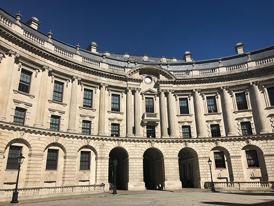 A photo of Horse Guards, an impressive building with arches, in the sunshine