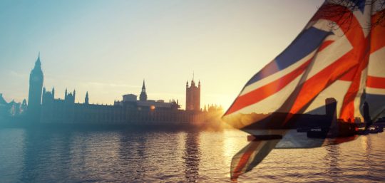 Houses Of Parliament With Union Jack Flag