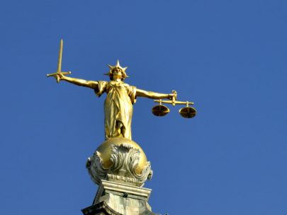 A photo of the Lady Justice Monument on a clear sunny day