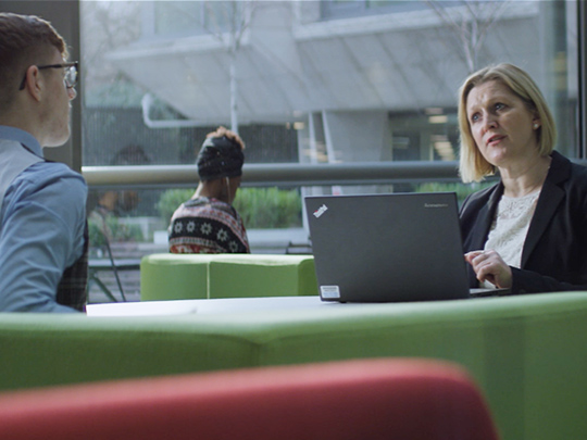 Two Cps Team Members In Conversation