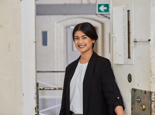 image of a graduate recruit at work in a prison