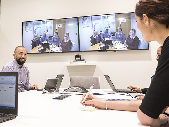 A group of colleagues in a Video Conference